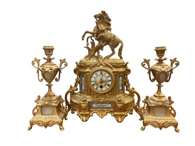 Lot 277 - Continental gilt metal and porcelain mounted mantel clock with rearing horse surmount, and garniture vases, probably associated