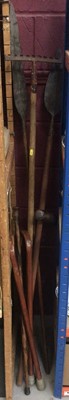 Lot 827 - Group of walking sticks together with two spears and a rake