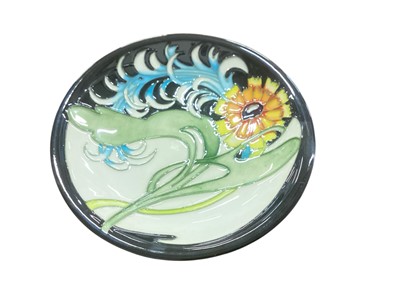 Lot 5046 - Moorcroft pottery pin dish decorated in the Lily Plume pattern, impressed marks, dated 2006, 12cm diameter
