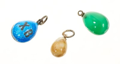 Lot 528 - Russian polished hardstone egg charm with silver bail bearing hallmark of Fedor Afanasiev, workmaster at Fabergé