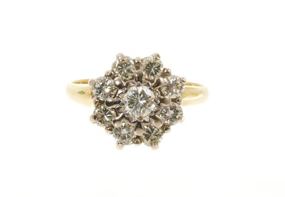 Lot 517 - Diamond cluster ring with a flower head cluster of nine brilliant cut diamonds in claw setting on 18ct gold shank