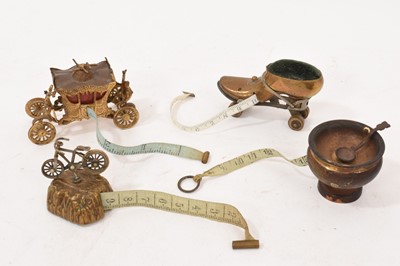 Lot 733 - Early 20th century novelty roller skate tape measure dispenser