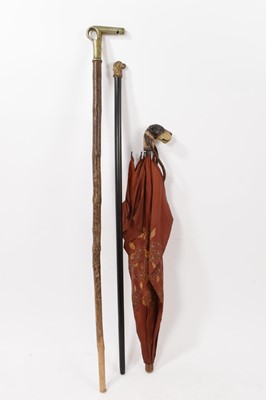 Lot 752 - Set of three dog themed sticks