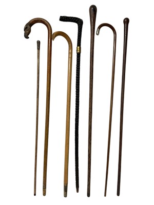 Lot 753 - Group of antique walking sticks including eagle headed stick with silver mounts, various others