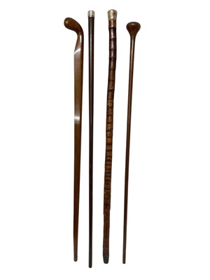 Lot 754 - White metal mounted sprouts stalk walking stick, and three further sticks