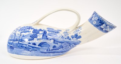 Lot 78 - Unusual pair of Copeland & Garrett blue and white transfer printed male and female urinals, circa 1840, in the Spode Tower pattern, 30cm and 32cm long
