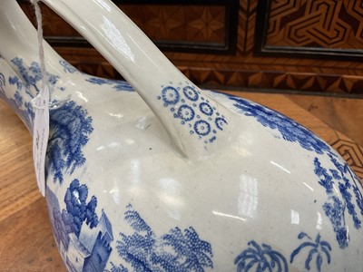 Lot 78 - Unusual pair of Copeland & Garrett blue and white transfer printed male and female urinals, circa 1840, in the Spode Tower pattern, 30cm and 32cm long