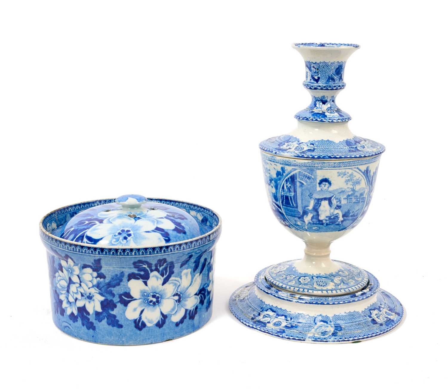 Lot 79 - Early 19th century blue and white part smoker's set, comprising goblet, candlestick and stand, the goblet in the Cow Polisher pattern, together with butter dish and cover with pierced hearts to...