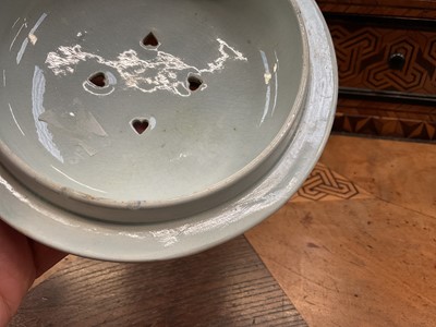 Lot 79 - Early 19th century blue and white part smoker's set, comprising goblet, candlestick and stand, the goblet in the Cow Polisher pattern, together with butter dish and cover with pierced hearts to...