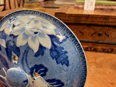 Lot 79 - Early 19th century blue and white part smoker's set, comprising goblet, candlestick and stand, the goblet in the Cow Polisher pattern, together with butter dish and cover with pierced hearts to...
