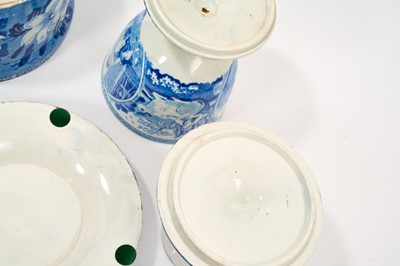 Lot 79 - Early 19th century blue and white part smoker's set, comprising goblet, candlestick and stand, the goblet in the Cow Polisher pattern, together with butter dish and cover with pierced hearts to...