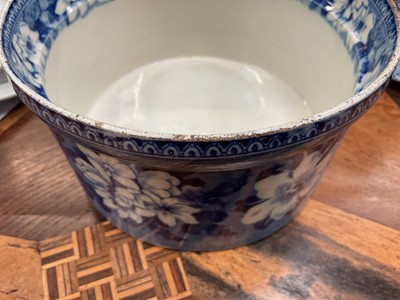 Lot 79 - Early 19th century blue and white part smoker's set, comprising goblet, candlestick and stand, the goblet in the Cow Polisher pattern, together with butter dish and cover with pierced hearts to...