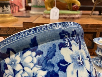 Lot 79 - Early 19th century blue and white part smoker's set, comprising goblet, candlestick and stand, the goblet in the Cow Polisher pattern, together with butter dish and cover with pierced hearts to...