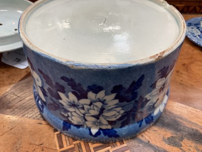 Lot 79 - Early 19th century blue and white part smoker's set, comprising goblet, candlestick and stand, the goblet in the Cow Polisher pattern, together with butter dish and cover with pierced hearts to...