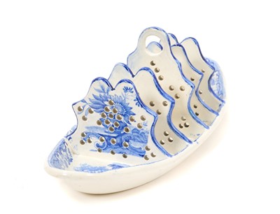 Lot 81 - Early 19th century blue and white Spode toast rack, printed in the Fruit and Flower pattern, impressed and printed 'Spode' marks, 24cm wide