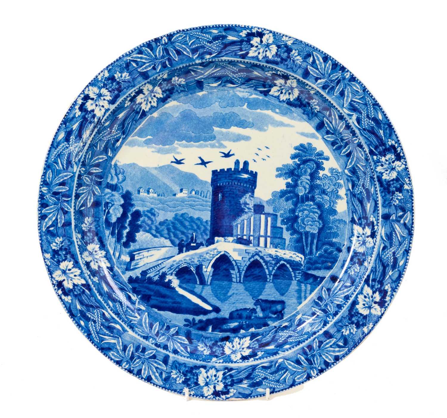 Lot 82 - Large early 19th century blue and white circular meat platter, printed in the Bridge of Lucarno pattern, 37.5cm diameter