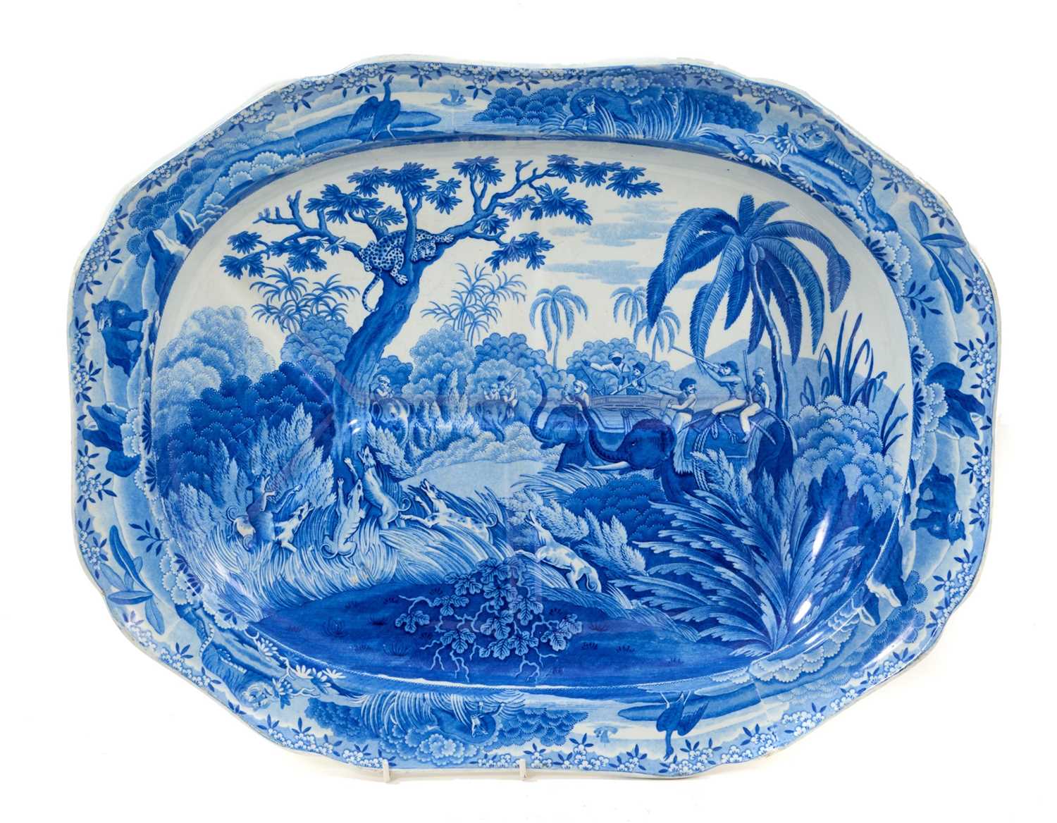 Lot 84 - Impressive early 19th century Spode blue and white 'well and tree' platter printed with the Indian Sporting scene 'Shooting a Leopard', impressed and printed 'Spode' marks, 53cm wide