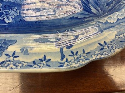 Lot 84 - Impressive early 19th century Spode blue and white 'well and tree' platter printed with the Indian Sporting scene 'Shooting a Leopard', impressed and printed 'Spode' marks, 53cm wide