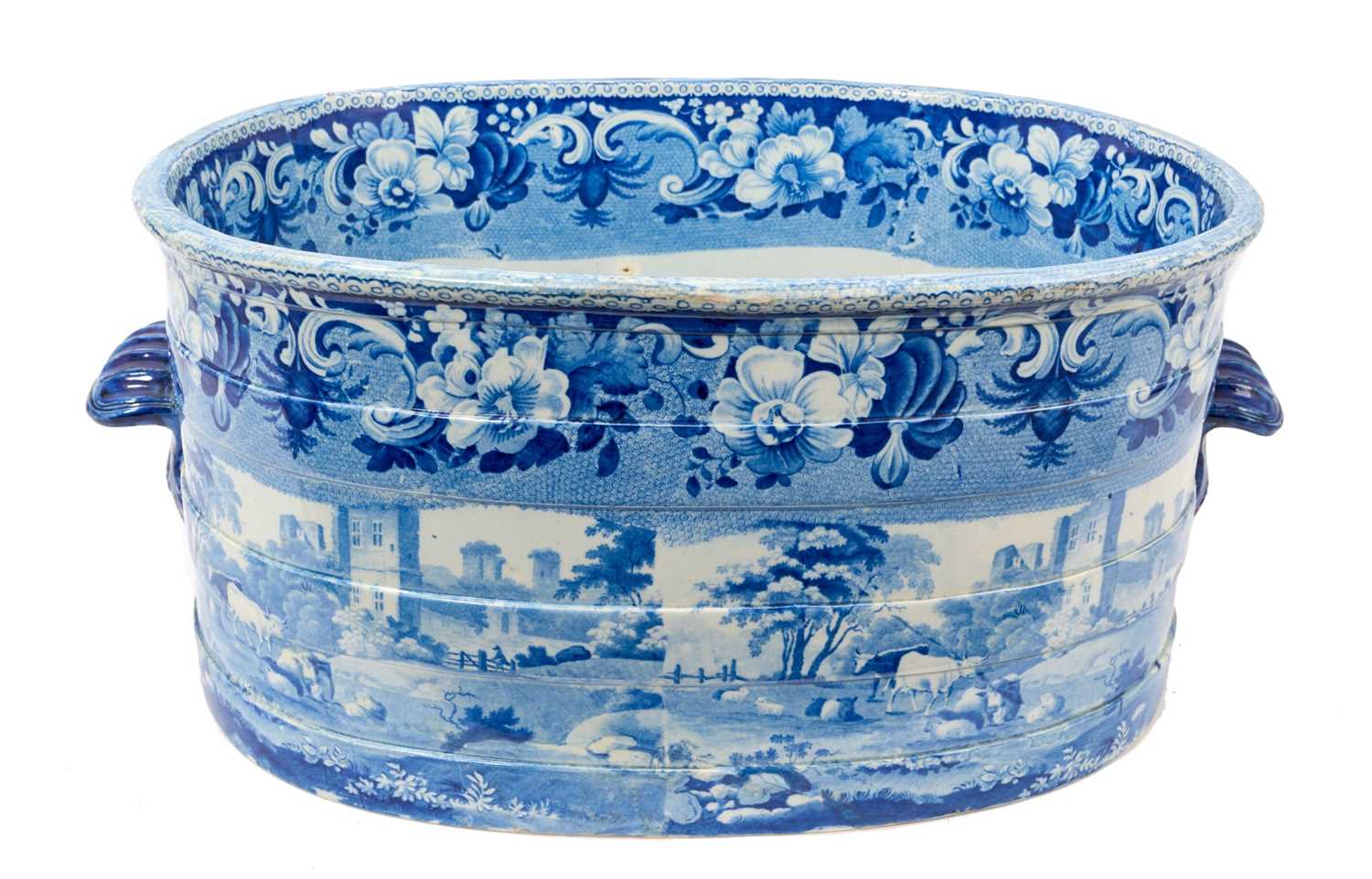 Lot 87 - Rare early 19th century blue and white foot bath, printed with Llanthony Abbey, Monmouthshire, alongside various castle ruin prints and a pineapple border, titled stamp mark to base with additio...