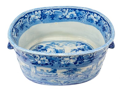 Lot 87 - Rare early 19th century blue and white foot bath, printed with Llanthony Abbey, Monmouthshire, alongside various castle ruin prints and a pineapple border, titled stamp mark to base with additio...