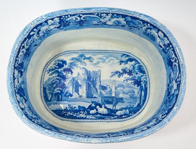 Lot 87 - Rare early 19th century blue and white foot bath, printed with Llanthony Abbey, Monmouthshire, alongside various castle ruin prints and a pineapple border, titled stamp mark to base with additio...