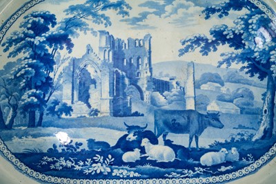 Lot 87 - Rare early 19th century blue and white foot bath, printed with Llanthony Abbey, Monmouthshire, alongside various castle ruin prints and a pineapple border, titled stamp mark to base with additio...