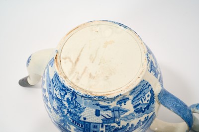 Lot 88 - Large early 19th century blue and white punch pot and cover, printed with chinoiserie scene, 32.5cm from spout to handle, together with a blue and white teapot with rural scene, 23cm (2)