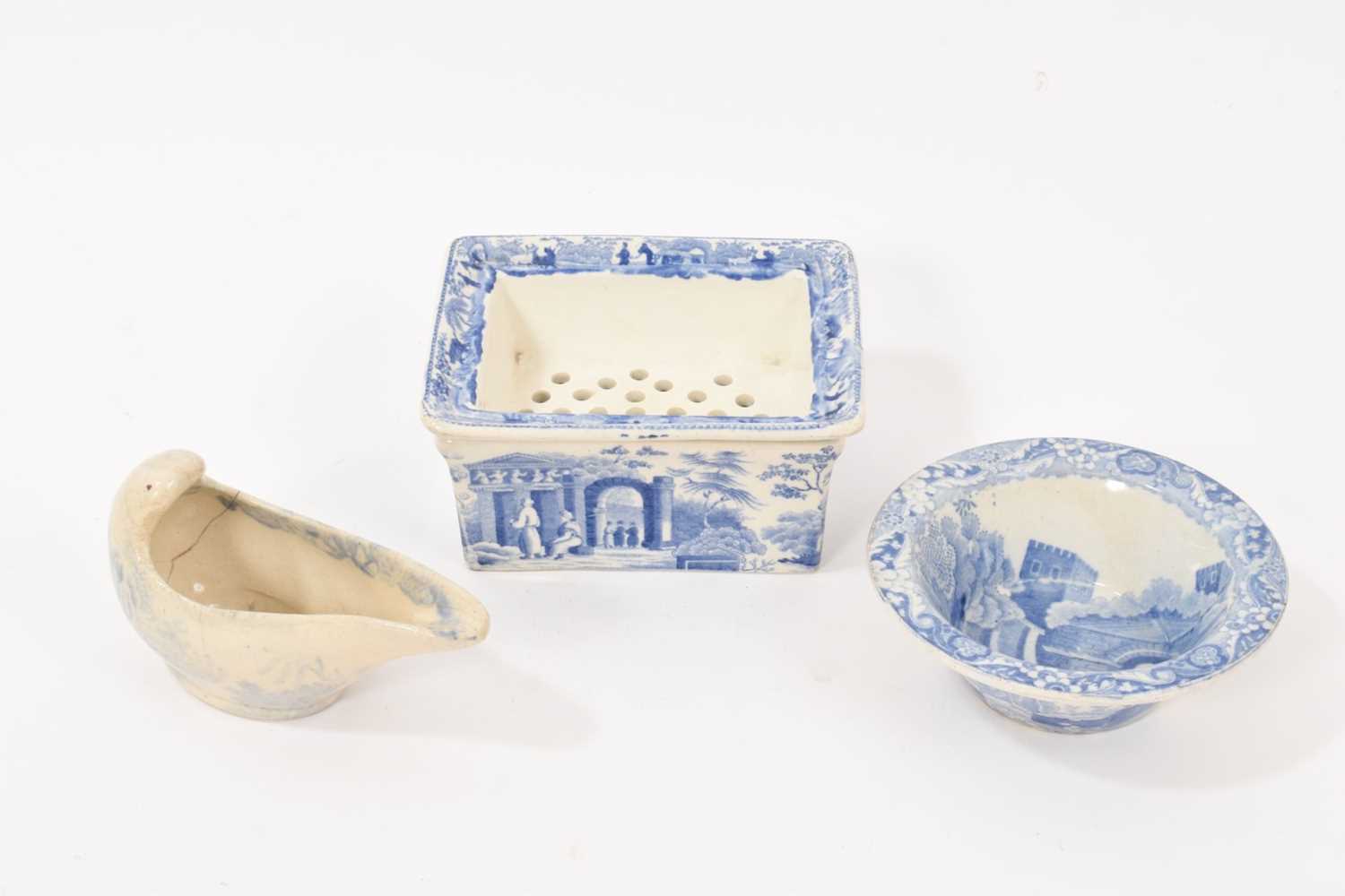 Lot 90 - Three early 19th century blue and white printed items, including a soap dish and pierced cover in the Caramanian pattern, marked Copeland & Garrett, a small blue and white patty pan in the C...