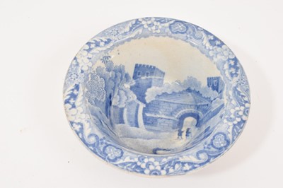 Lot 90 - Three early 19th century blue and white printed items, including a soap dish and pierced cover in the Caramanian pattern, marked Copeland & Garrett, a small blue and white patty pan in the C...
