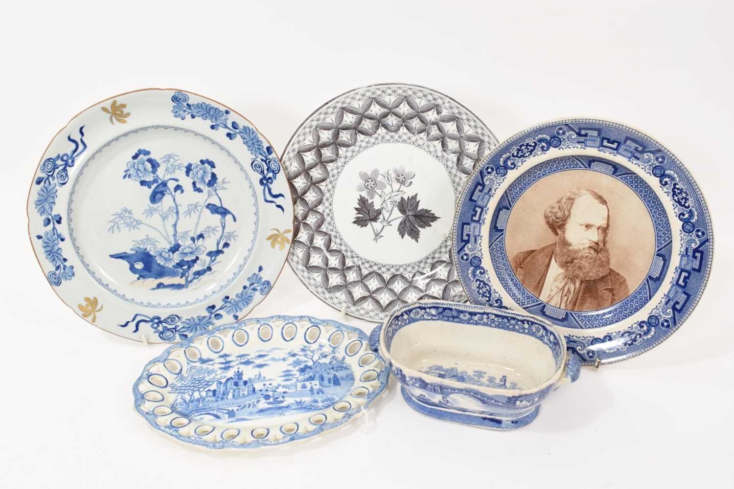 Lot 91 - Group of blue and white printed items including two Spode plates, a Spode basket stand, a sauce tureen base in Wild Rose pattern, etc (5)