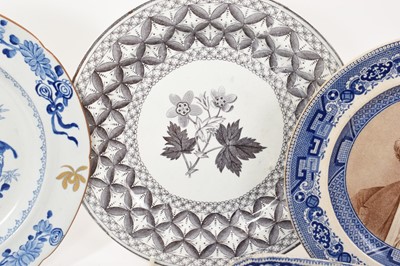 Lot 91 - Group of blue and white printed items including two Spode plates, a Spode basket stand, a sauce tureen base in Wild Rose pattern, etc (5)