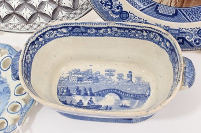 Lot 91 - Group of blue and white printed items including two Spode plates, a Spode basket stand, a sauce tureen base in Wild Rose pattern, etc (5)