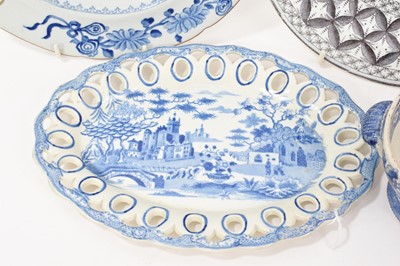 Lot 91 - Group of blue and white printed items including two Spode plates, a Spode basket stand, a sauce tureen base in Wild Rose pattern, etc (5)