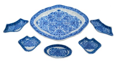 Lot 93 - Early 19th century blue and white pickle set, of lozenge form on pedestal base, with five small fitted dishes, printed with the Flower Cross pattern, 28cm across