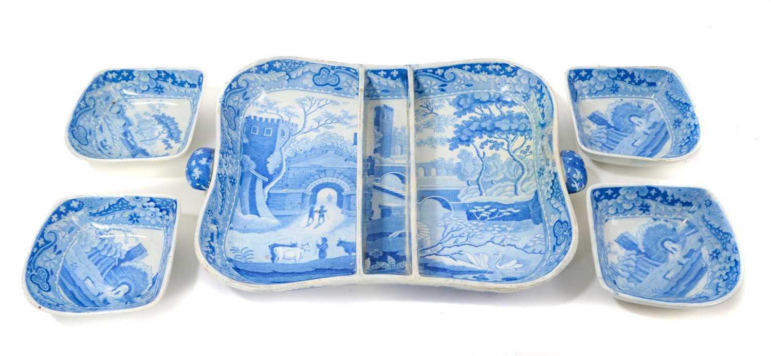 Lot 94 - Early 19th century Spode blue and white twin-handled pickle set / hors d'oeuvre dish, of shaped square form, printed with the Castle pattern, with four dishes and central divider, 28.5cm wide