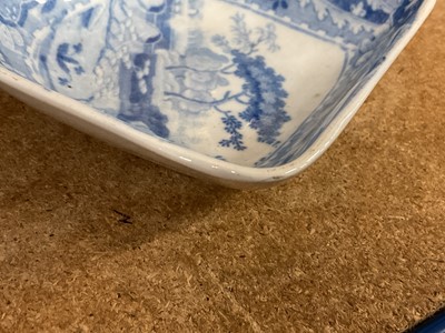 Lot 94 - Early 19th century Spode blue and white twin-handled pickle set / hors d'oeuvre dish, of shaped square form, printed with the Castle pattern, with four dishes and central divider, 28.5cm wide