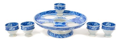 Lot 96 - Early 19th century Spode blue and white egg cruet, printed in the Bridge of Lucarno pattern, printed 'Spode' mark to all pieces, the stand 19cm diameter