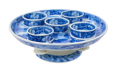Lot 96 - Early 19th century Spode blue and white egg cruet, printed in the Bridge of Lucarno pattern, printed 'Spode' mark to all pieces, the stand 19cm diameter