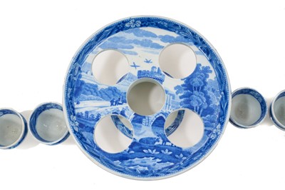 Lot 96 - Early 19th century Spode blue and white egg cruet, printed in the Bridge of Lucarno pattern, printed 'Spode' mark to all pieces, the stand 19cm diameter