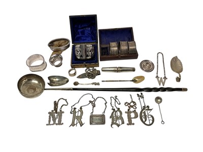 Lot 238 - Group of miscellaneous silver and white metal, including wine labels, napkin rings