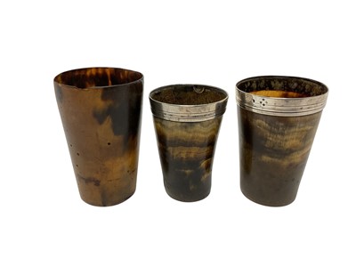 Lot 333 - Two Victorian beakers with silver hallmarked rims, together with one other beaker