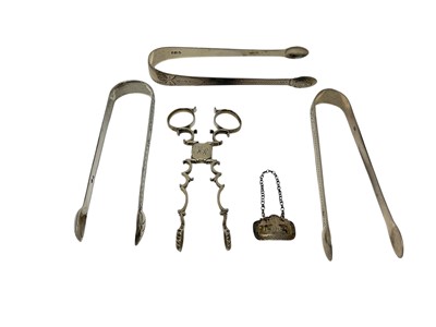 Lot 335 - Tiny Georgian port label, Georgian silver sugar nips and three pairs of Georgian sugar tongs