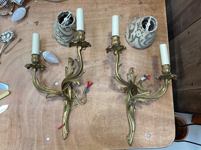 Lot 5056 - Pair of brass twin branch wall lights and shades, with acanthus leaf moulding