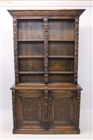 Lot 1286 - Late 19th century heavily carved oak Bookscase...