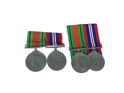 Lot 13 - Second World War medal pair comprising Defence and War medals, together with another matching pair (both pairs mounted on bar).