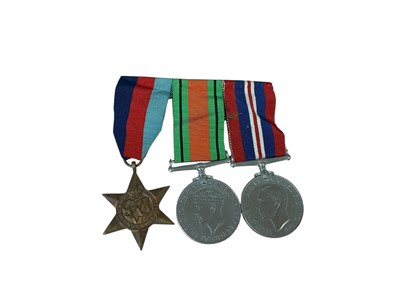 Lot 15 - Second World War medal trio comprising 1939 - 1945 Star, Defence and War medals (mounted on bar).