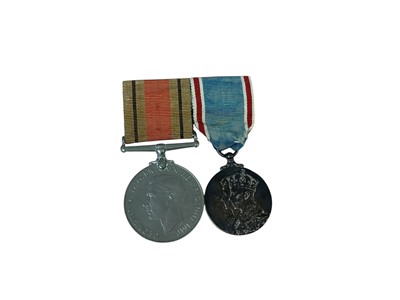 Lot 16 - Medal pair comprising George VI 1937 Coronation medal and Second World War Defence medal (mounted on bar).