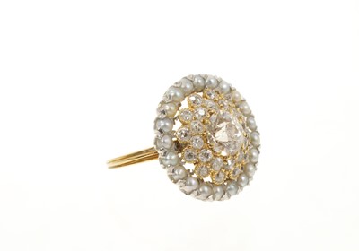 Lot 435 - Diamond and seed pearl cluster ring with an old cut diamond estimated to weigh approximately 1.1ct, surrounded by two-tiered border of further old cut diamonds, surrounded by an outer border of...