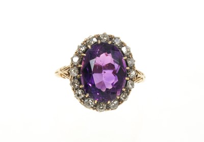 Lot 436 - Late Victorian amethyst and diamond cluster ring with an oval mixed cut amethyst surrounded by old cut diamonds in 18ct gold setting