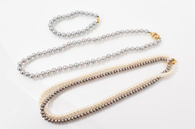 Lot 526 - Cultured grey pearl necklace on gold clasp with matching bracelet, and one other (3)